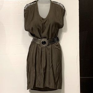 Green dress with studded chain shoulder straps.